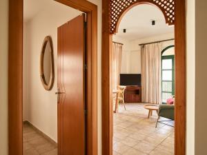 a hallway with a door leading to a living room at Apartamentos Turísticos Casa de La Borrega in Estepona