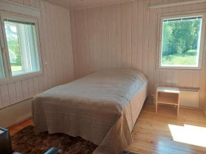 Postel nebo postele na pokoji v ubytování Palju Joutsen Pesä + 6 fotografií