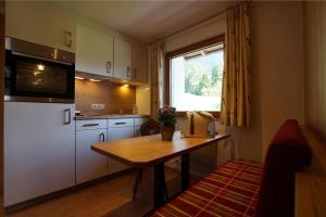 Kuchyň nebo kuchyňský kout v ubytování Matschun Appartements