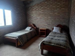 Postel nebo postele na pokoji v ubytování Paz cordillerana