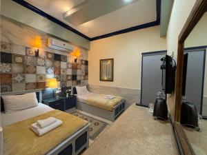 Postel nebo postele na pokoji v ubytování Sababa Hotel