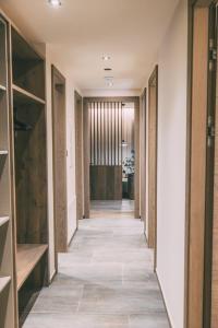 a hallway of a house with wooden doors at LIVALPIN ToGether in Garmisch-Partenkirchen