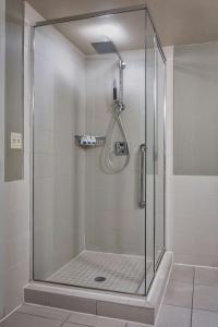 a shower with a glass door in a bathroom at The Westin Memphis Beale Street in Memphis