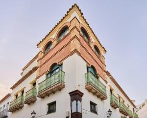 a building with balconies on the side of it at Apartamentos Turísticos Casa de La Borrega in Estepona
