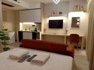 a room with a couch and a table with towels at Doğan Palace Hotel in Istanbul