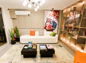 a living room with a white couch and a table at Yours Hotel Lifestyle in Chiclayo