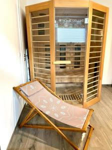 a glass door of a closet with a table in front of it at Wohlfühloase in Windeby