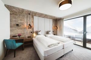 Łóżko lub łóżka w pokoju w obiekcie Mooshaus Winterresort