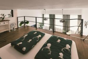 a living room with a couch with a blanket on it at "Hunter's Suite"- at the heart of Hartberg I Parking in Hartberg