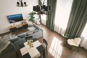 Televiisor ja/või meelelahutuskeskus majutusasutuses "Hunter's Suite"- at the heart of Hartberg I Parking