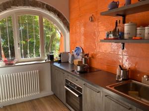 a kitchen with a sink and a window at Appartamento Betta in Borgo in Gorizia