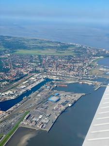 an aerial view of a city next to a body of water at Meerliebe in Cuxhaven