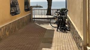 a bike parked on the side of a building at Disfruta frente al mar, a 50 metros, y desconecta in Torre de la Horadada