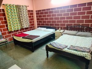 Katil atau katil-katil dalam bilik di Service Apartment 1BHK
