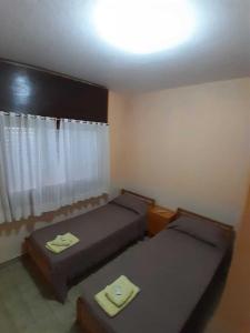 Ένα ή περισσότερα κρεβάτια σε δωμάτιο στο Hotel New SAN MARCOS