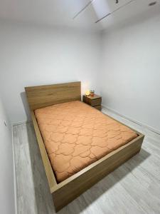 a bedroom with a bed in a white wall at Casa do Castelo in Trancoso