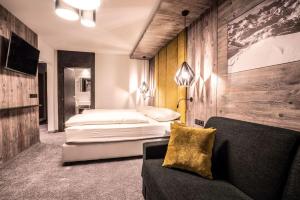 Łóżko lub łóżka w pokoju w obiekcie Mooshaus Winterresort