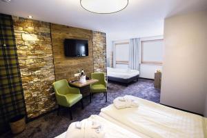 Łóżko lub łóżka w pokoju w obiekcie Mooshaus Winterresort