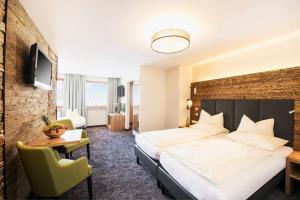 Łóżko lub łóżka w pokoju w obiekcie Mooshaus Winterresort