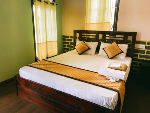 Ένα ή περισσότερα κρεβάτια σε δωμάτιο στο Hilltown Villa Holiday's