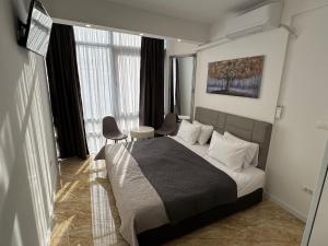 Una cama o camas en una habitación de Sarajevo Center Point