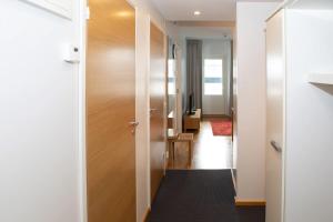 a hallway with a door leading into a room at Levi Chalets 1202 in Levi