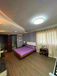 Postel nebo postele na pokoji v ubytování King's Mansion Resort