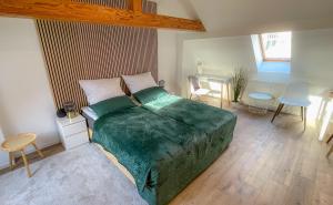 a bedroom with a bed and a table and chairs at Apartment in Weißenfels bei Leuna mit WLAN & Terrasse in Weißenfels
