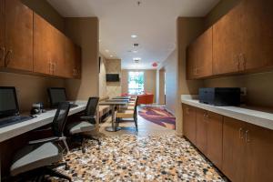 an office with a conference room with a table and chairs at SpringHill Suites by Marriott San Antonio Downtown-Riverwalk Area in San Antonio