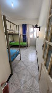 A bed or beds in a room at MEETING POINT HOSTEL-Praia Group Reservations