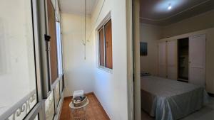A bed or beds in a room at MEETING POINT HOSTEL-Praia Group Reservations