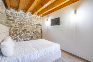 Letto o letti in una camera di Moinhos do Coto