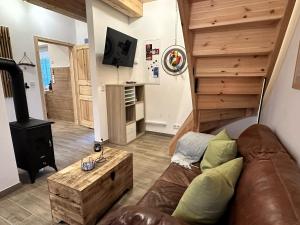 a living room with a couch and a wood stove at Haus Treibsel in Dagebüll