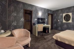 TV a/nebo společenská místnost v ubytování Hotel Concorde