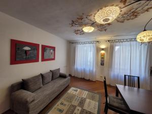 a living room with a couch and a table at DeTillierStudiò2 in Aosta