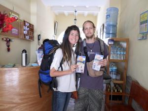 a man and a woman posing for a picture in a store at OkiDoki Cusco Hostal in Cusco