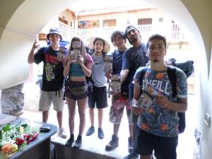 a group of people posing for a picture at OkiDoki Cusco Hostal in Cusco