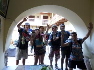 a group of young people posing for a picture at OkiDoki Cusco Hostal in Cusco