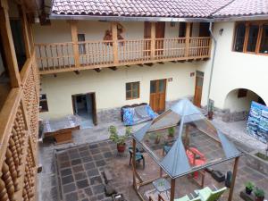 an overhead view of a house with a glass patio at OkiDoki Cusco Hostal in Cusco