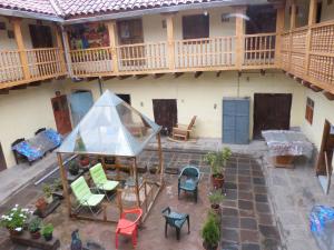 an aerial view of a house with a patio at OkiDoki Cusco Hostal in Cusco