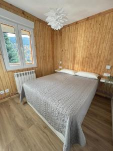 Ένα ή περισσότερα κρεβάτια σε δωμάτιο στο Pico Cerler