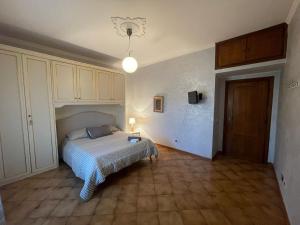 a bedroom with a bed and a light on the wall at Eternal city stays in Rome +62 photos