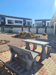 a picnic table in front of a building at Lerewa in Gaborone