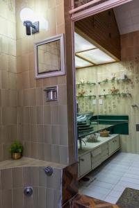 a bathroom with a sink and a mirror at Casa en centro de Coyoacán in Mexico City