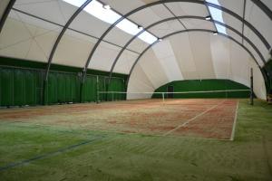 a tennis court in a tent with a tennis court at Rychwałd - Full House! in Rychwałd +25 photos