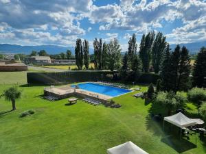 an aerial view of a yard with a swimming pool at Puigcerda Park Hotel in Puigcerdà