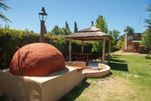 a gazebo with a table and a gazebo at Complejo BenjaLuna in San Rafael