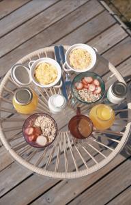 a table with plates of food and drinks on it at Andes Guatavita in Guatavita