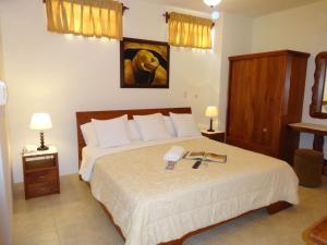 Postel nebo postele na pokoji v ubytování Hotel Del Sol Galapagos