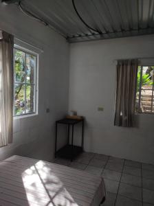 a white room with a bed and two windows at Casa Campo Loma Larga in La Palma +17 photos